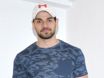 Sooraj Pancholi snapped with a kid fan at Gym launch