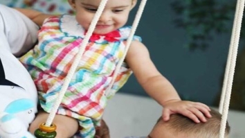 Aww! Karan Johar’s twins Roohi and Yash look cute while enjoying on a swing!