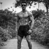 Tiger Shroff flaunts his killer washboard abs in this black and photo