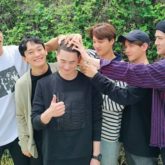 EXO members come together to support Suho as he enlists in military