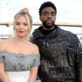 Sienna Miller reveals late Chadwick Boseman took pay cut in 21 Bridges
