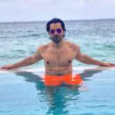 Varun Dhawan is chilling in the pool in Maldives flaunting his ab-tastic physique