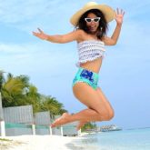 Hina Khan looks ecstatic as she poses in bikini bottoms and a crop top by the beach