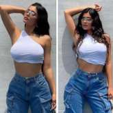 Kylie Jenner channels 90s and Y2K vibes in one-shoulder white crop top and baggy wide-leg jeans