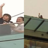 Shah Rukh Khan’s son AbRam Khan waves to the media from his house after brother Aryan Khan gets bail