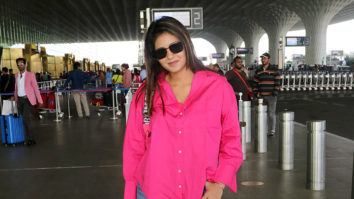 Anjali Arora gets snapped in a bright pink shirt as she poses for paps