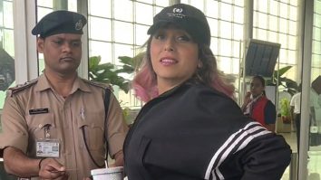 Neha Bhasin waves at paps as she gets clicked at the airport